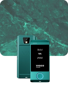 A product showcase image featuring a black Vasco Translator device from two angles against a dark, textured fabric background. The device on the left shows the back view, highlighting a camera lens with a flash and an embossed 